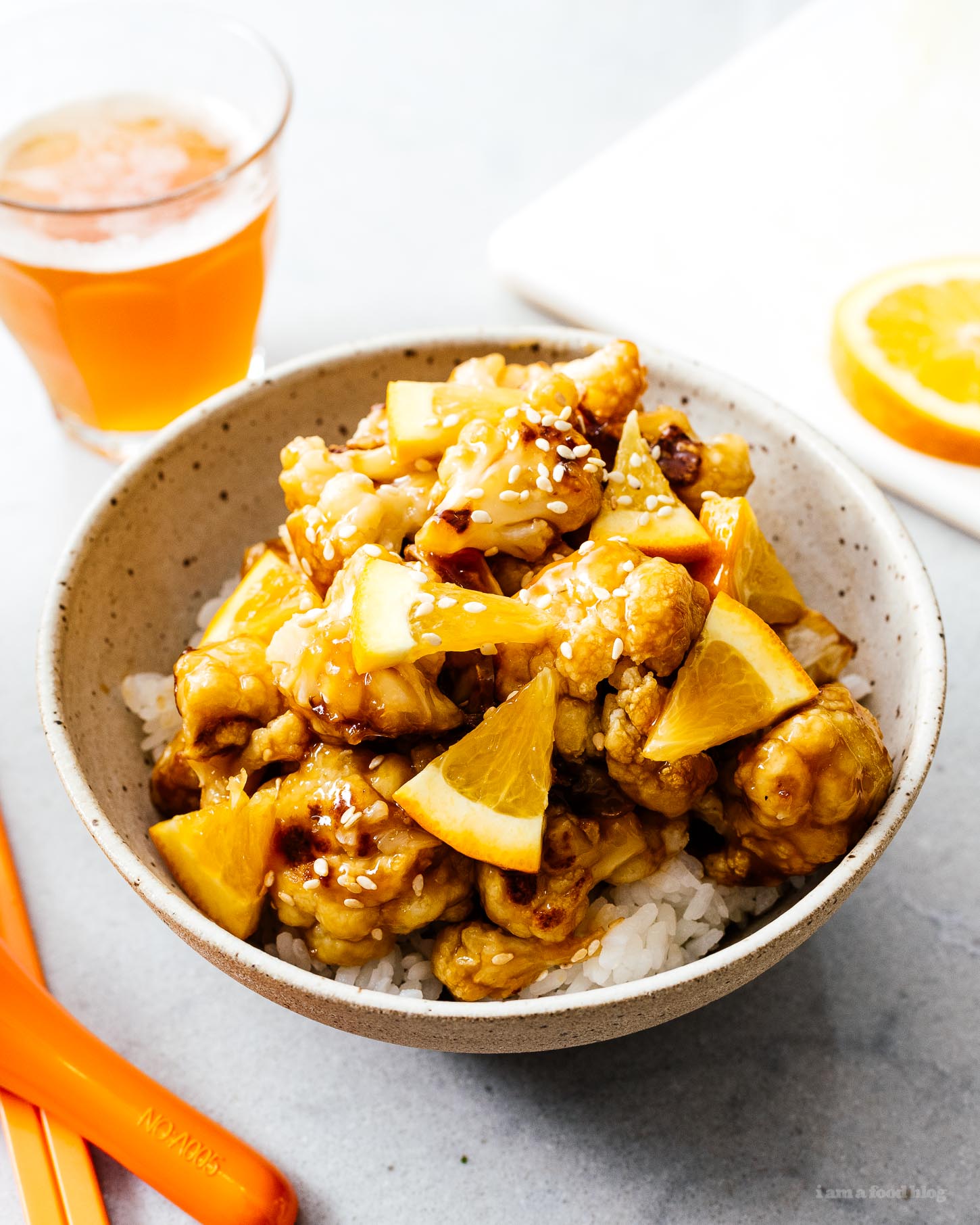 A super healthy, delicious, and easy oven broiled vegan orange cauliflower recipe. Everything that's great about orange chicken with zero guilt. #vegan #orangechicken #easyrecipes