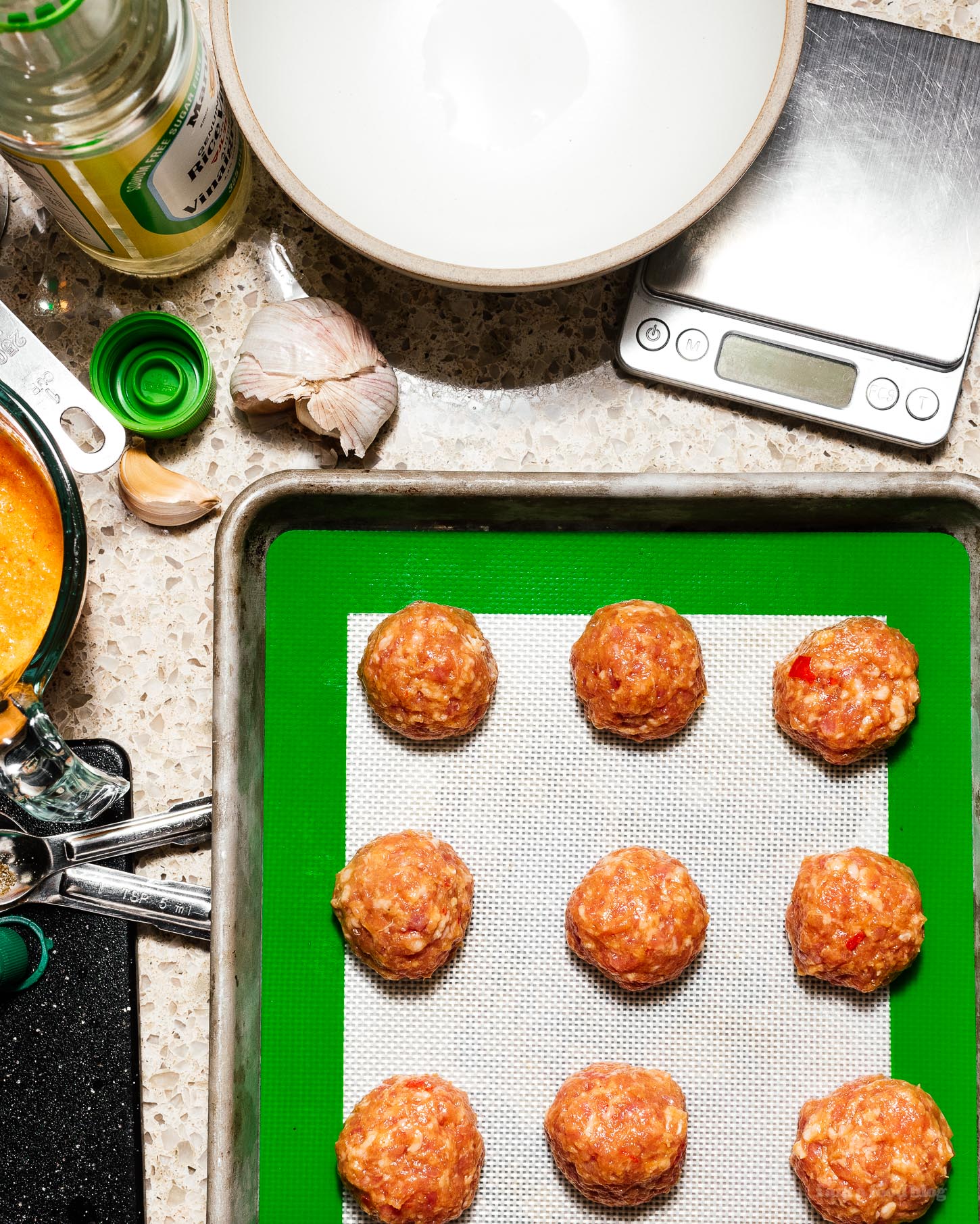 These low carb, keto friendly piri piri pork meatballs bring the spice and flavor. They’re baked in the oven for maximum ease and are served with cooling Greek yogurt for a tangy, creamy contrast. No more breadcrumbs! #piripiri #meatballs #recipes #dinner #bakedmeatballs #lowcarb #keto #ketorecipes #ketofriendly