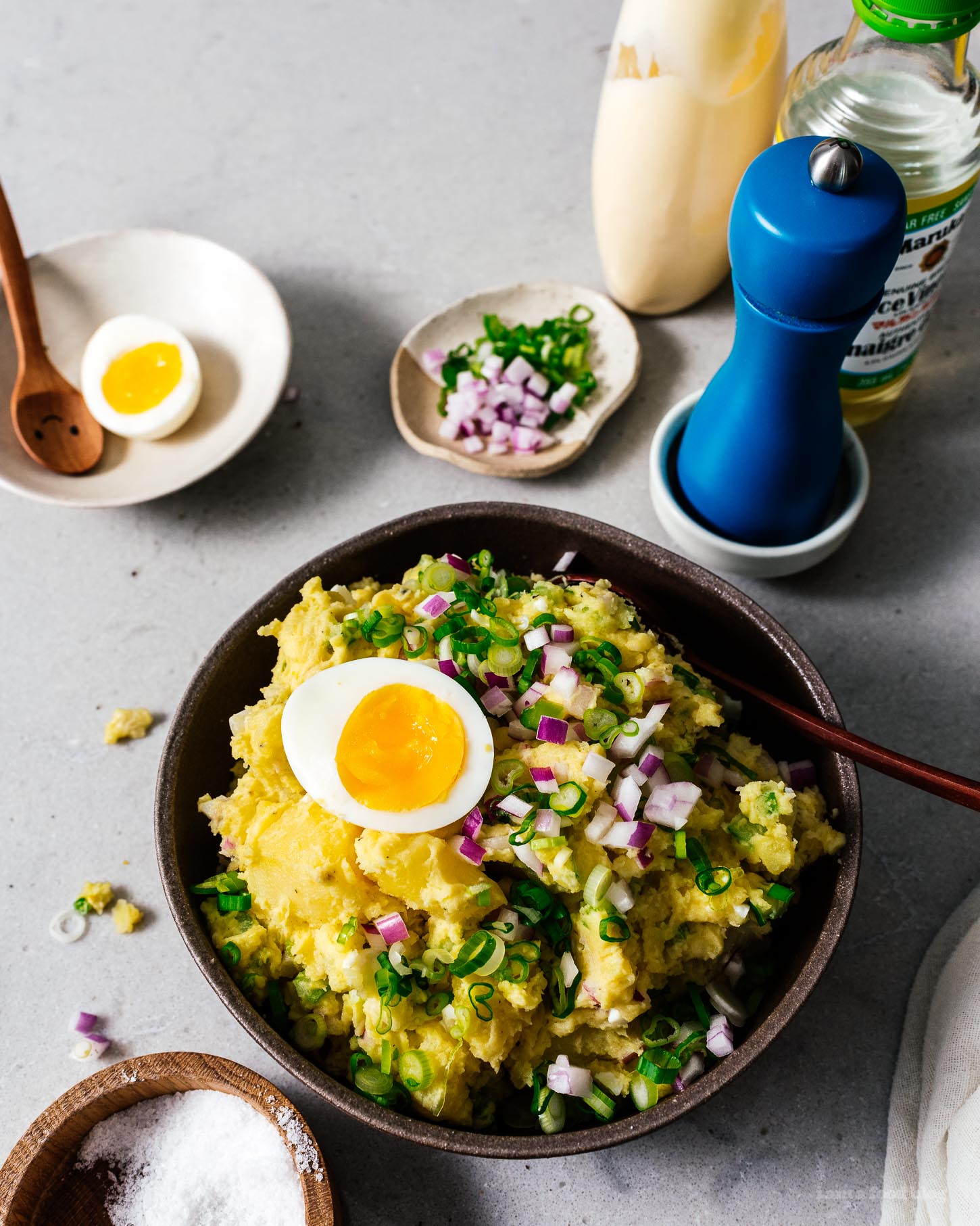 Make this classic perfect picnic potato salad and bring it to ever summer gathering! Creamy potatoes, crunchy celery, onions, and eggs combine into a salad you’ll be making and eating over and over again thanks to a secret ingredient: rice vinegar for tang. #potatosalad #potatoes #recipes #potatosaladrecipe