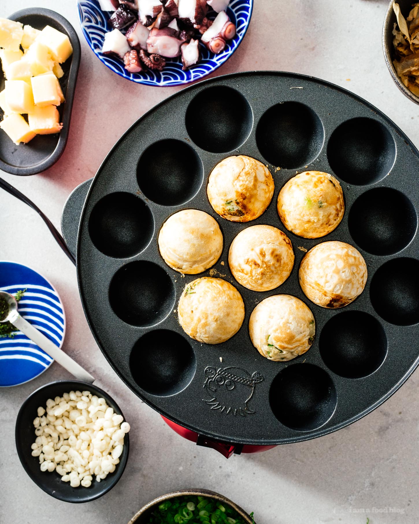 Throw a Japanese takoyaki dinner party with this takoyaki, the ultimate Japanese street food at the table with friends and family. Interactive, fun, and delicious! Authentic takoyaki recipe #japanesefood #recipes #takoyaki #streetfood #japan #tokyo #howto