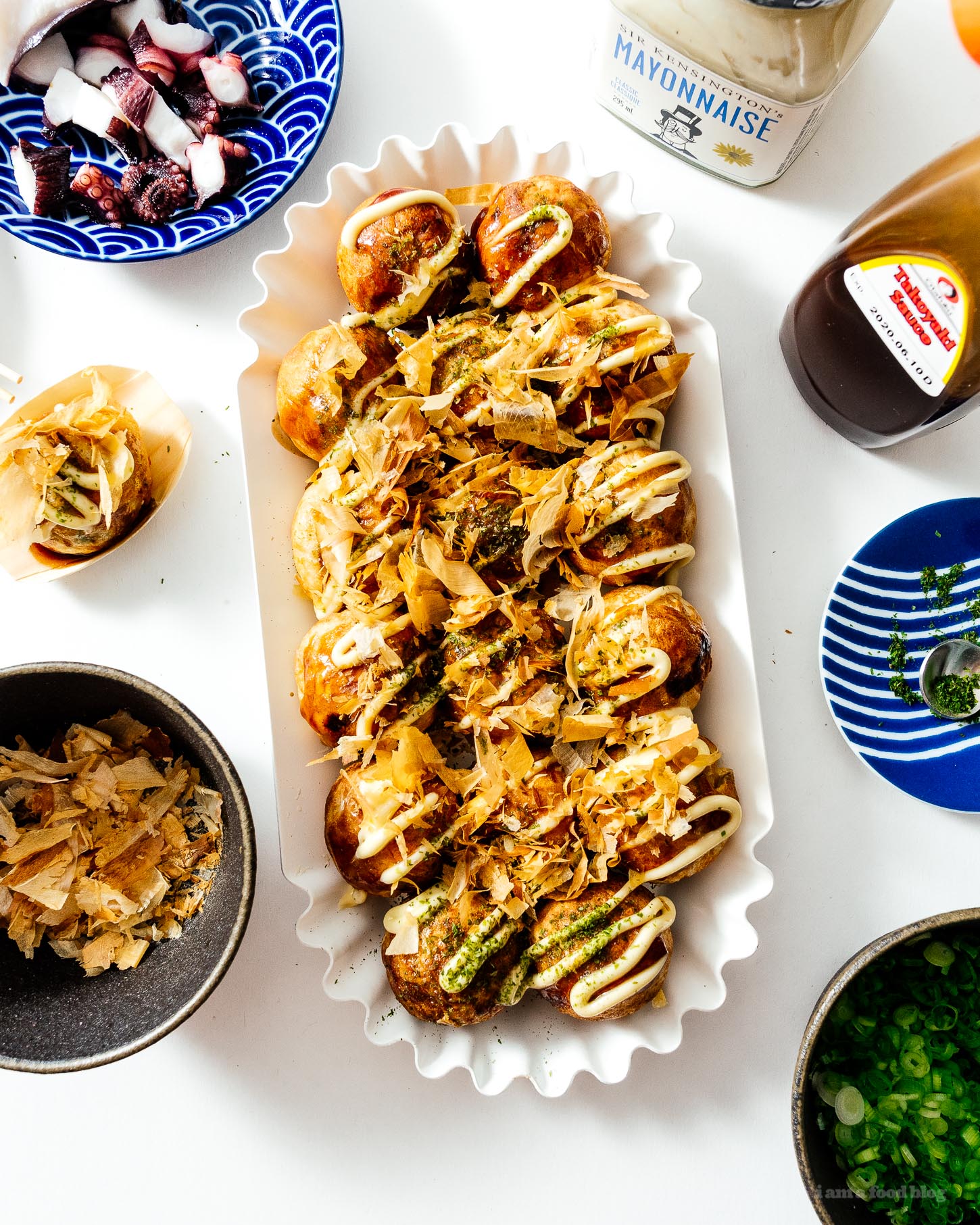 Throw a Japanese takoyaki dinner party with this takoyaki, the ultimate Japanese street food at the table with friends and family. Interactive, fun, and delicious! Authentic takoyaki recipe #japanesefood #recipes #takoyaki #streetfood #japan #tokyo #howto