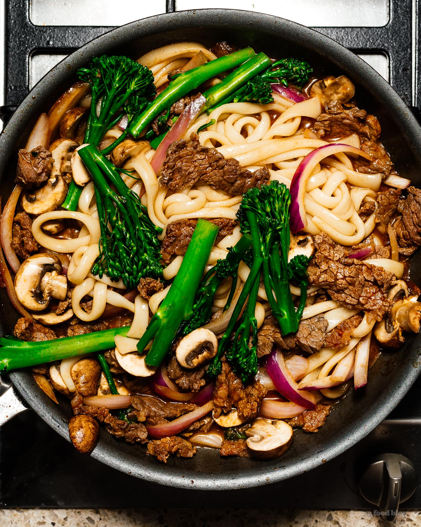 This is a weeknight stir fry udon based on japanese spicy beef that comes together easily and quickly in only 10 minutes. It's spicy, savory, and irresistably delicious. You'll never believe it only has 8 ingredients. #udon #weeknight #stirfry