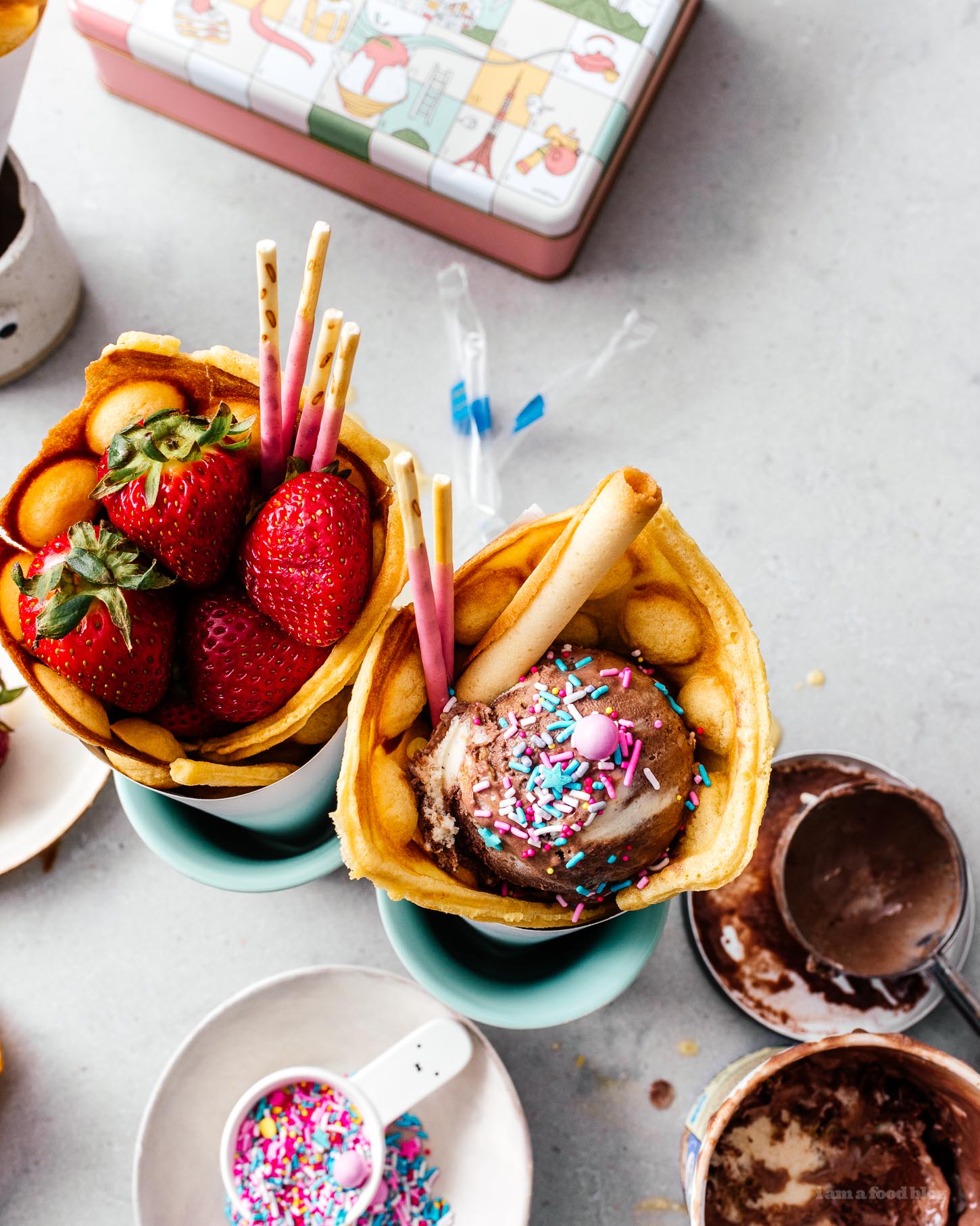 Make your own infinitely instagram friendly bubble waffle ice cream cones/puffle cones/eggloo egg waffle cones right at home. The batter comes together easily and you can fill your cones with ALL the things: ice cream, fruit, cookies, anything goes. #bubblewaffle #bubblewafflecones #hongkongbubblewaffles #pufflecone #eggloo #eggwaffle #recipes #dessertrecipes