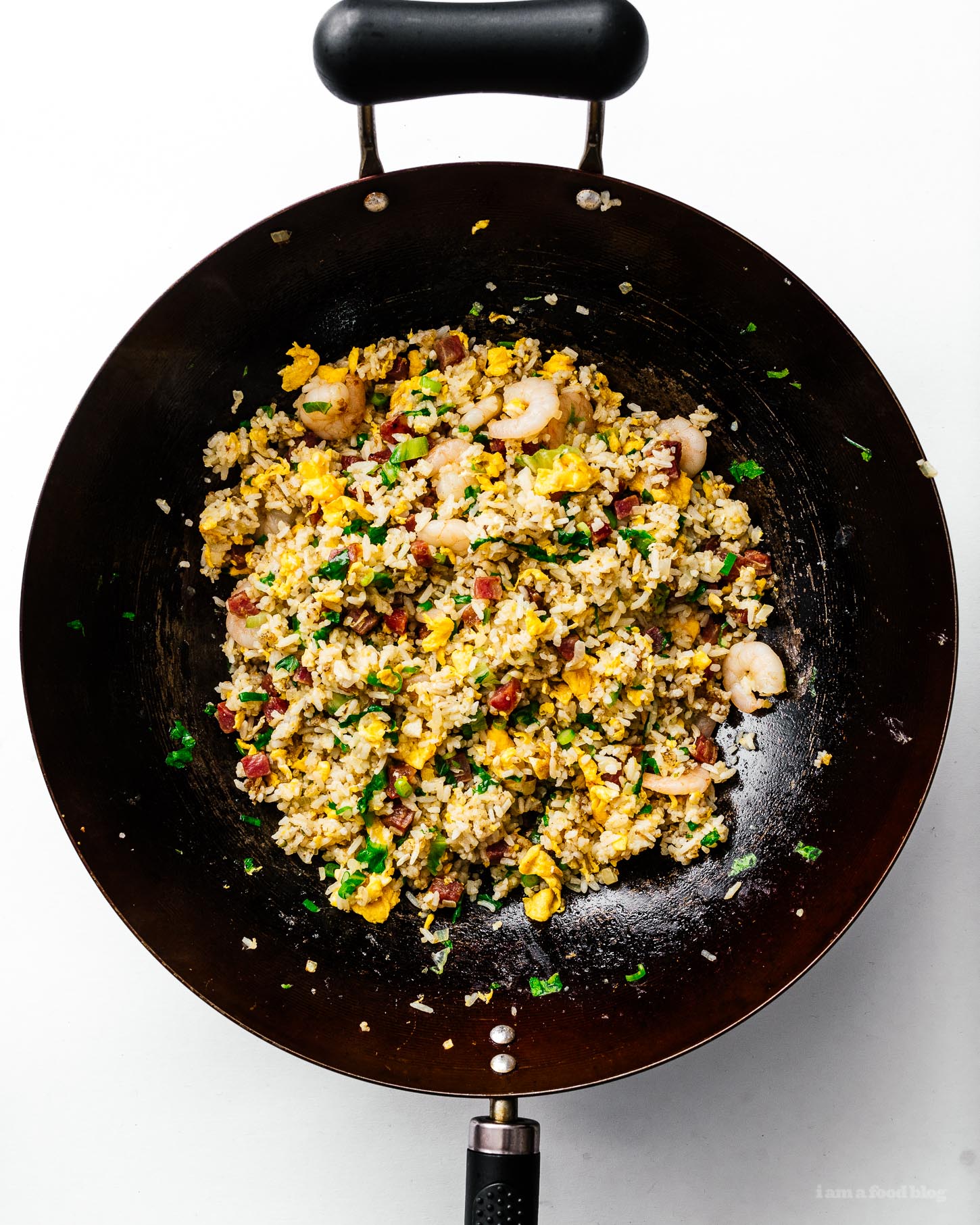 No matter what you call it: yang chow fried rice, young chow fried rice, yeung chow fried rice, or Yangzhou fried rice - there’s no denying that Chinese egg fried rice is delicious. This yang chow fried rice recipe will having you making better than takeout fried rice at home in no time flat. #friedrice #friedricerecipe #chinesefood #recipes #dinner #rice #takeout #betterthantakeout