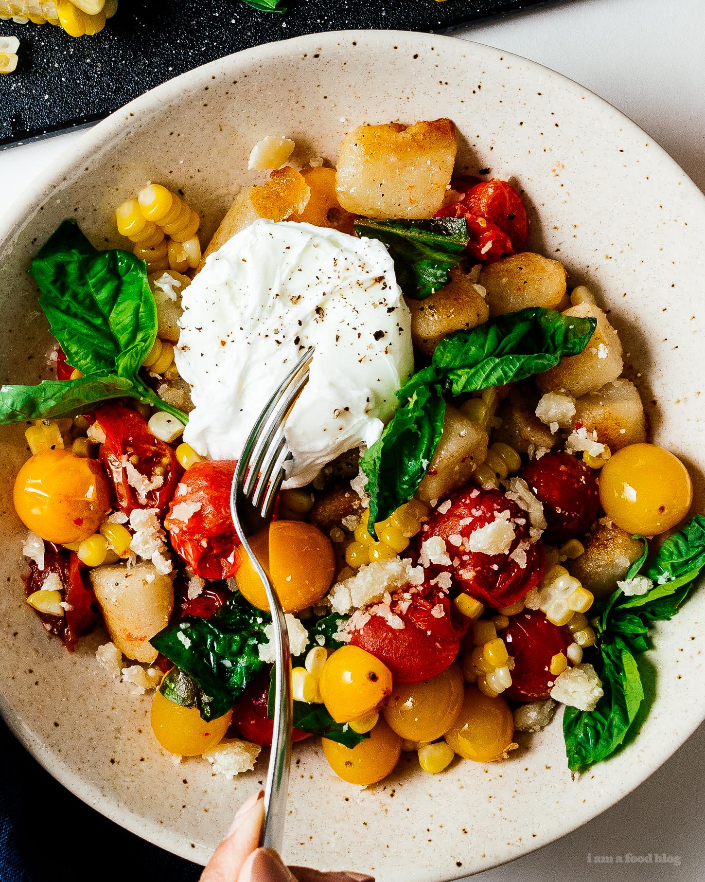How to cook trader joe’s cauliflower gnocchi with sweet oven roasted tomatoes and corn with the best low carb gnocchi out there: cauliflower gnocchi. Super easy, light, tasty, and filling! #cauliflowergnocchi #traderjoes #cauliflowerrecipes #cauliflower #gnocchi #tomatoes #corn #recipes #dinnerrecipes #dinner