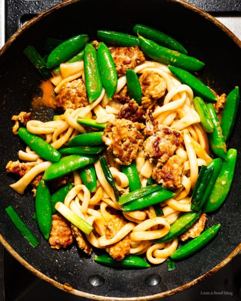If you’re looking for a quick and easy stir fry that’s full of flavor, look no further! You’re just 15 minutes away from a creamy coconut curry and crispy pork udon stir fry. Minimal chopping, one pan, spicy noodle-y goodness. #stirfry #recipes #dinner #thaifood #thaicurry #weeknight" width="1450" height="1813" class="alignnone size-full wp-image-28846
