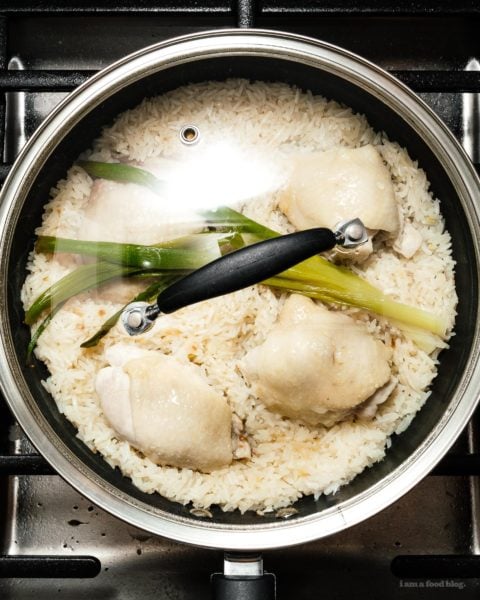 Super simple and satisfying Hainanese chicken rice: juicy steamed chicken and ginger garlic rice cooked in the same pot. It’s what you want for dinner, right now! #hainanesechickenrice #chickenrice #recipes #dinner #onepot #easy #chickenrecipe #rice #chickenandrice