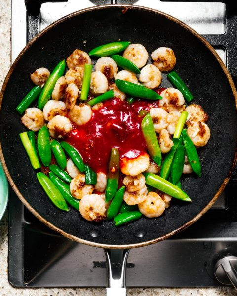 Shrimp and snap pea stir fry: a glossy, spicy, all-in-one protein and veggie dish that is just the perfect thing to make for a quick weeknight dinner. #stirfry #dinner #shrimp #snappeas