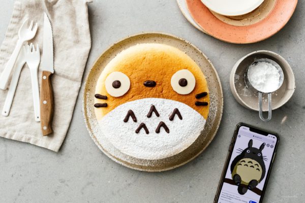 A super cute fluffy, jiggly Totoro cheesecake: pillowy soft, cotton-y, light-as-air cheesecake with just a hint of sweetness. #cheesecake #japanesecheesecake #fluffycheesecake #totorocake #totorocheesecake #totorofood #kawaiifood