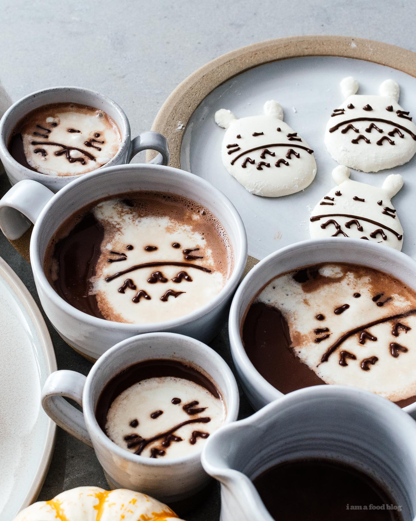 Did you know you can melt down store bought marshmallows and cut them into custom shapes. Make these super easy Totoro marshmallows today! #marshmallows #totoro #totoromarshmallows #totorofood #kawaiifood #hotchocolate 