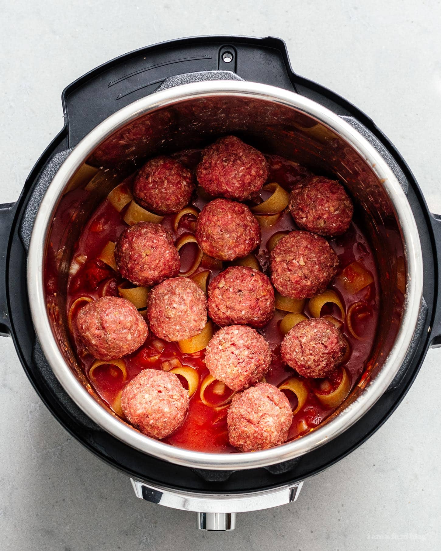 You're only 10 minutes away from the best pasta and meatballs you've ever made with this super easy one-pot instant pot pasta and meatballs recipe.