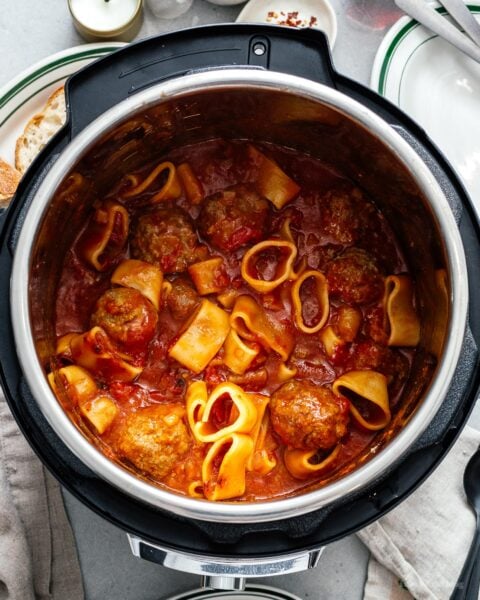 You're only 10 minutes away from the best pasta and meatballs you've ever made with this super easy one-pot instant pot pasta and meatballs recipe.