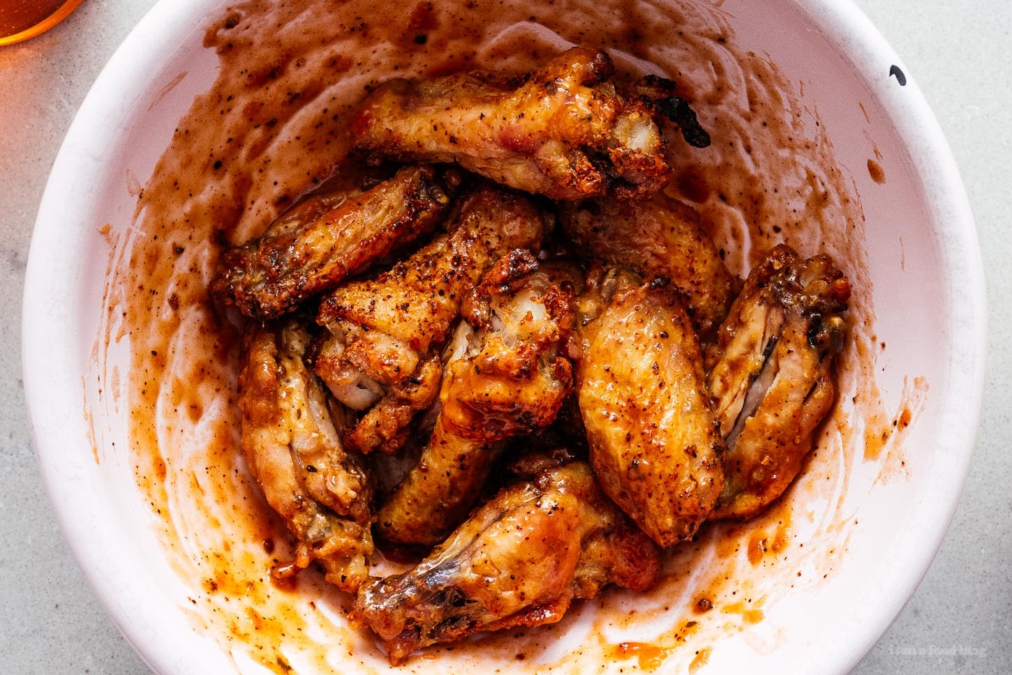 air fryer chicken wings tossed in hot sauce | www.iamafoodblog.com