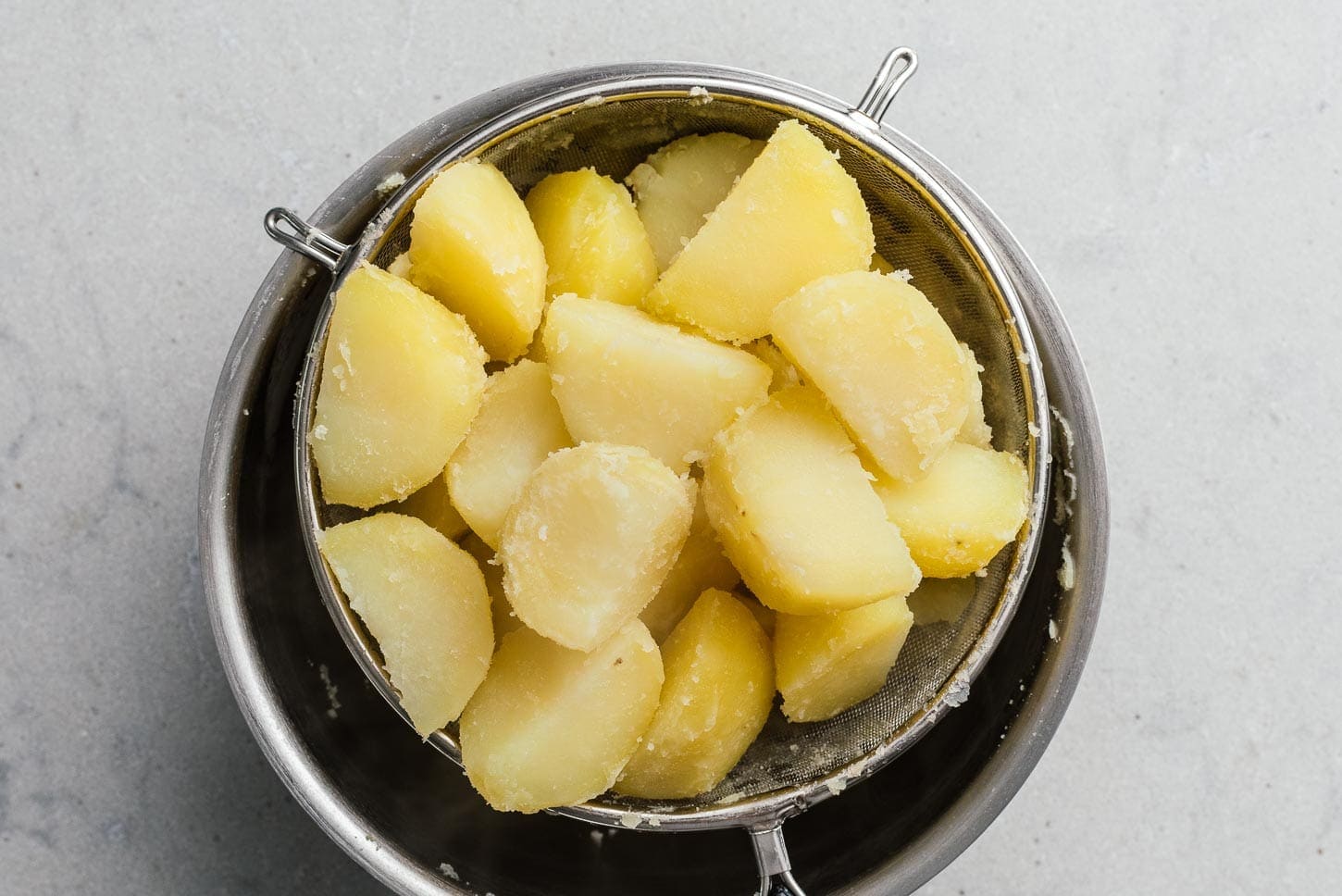 boiled potatoes in colander | www.iamafoodblog.com