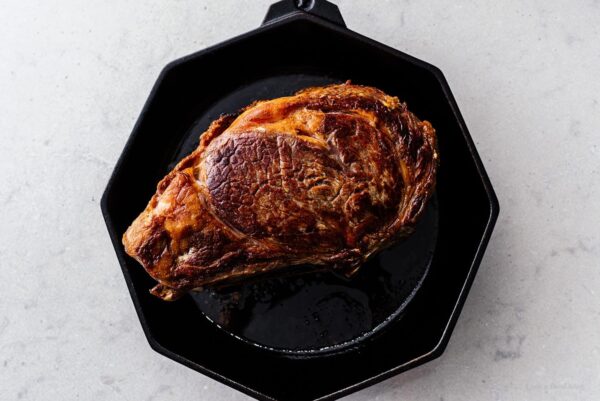 searing prime rib in a cast iron skillet | www.iamafoodblog.com